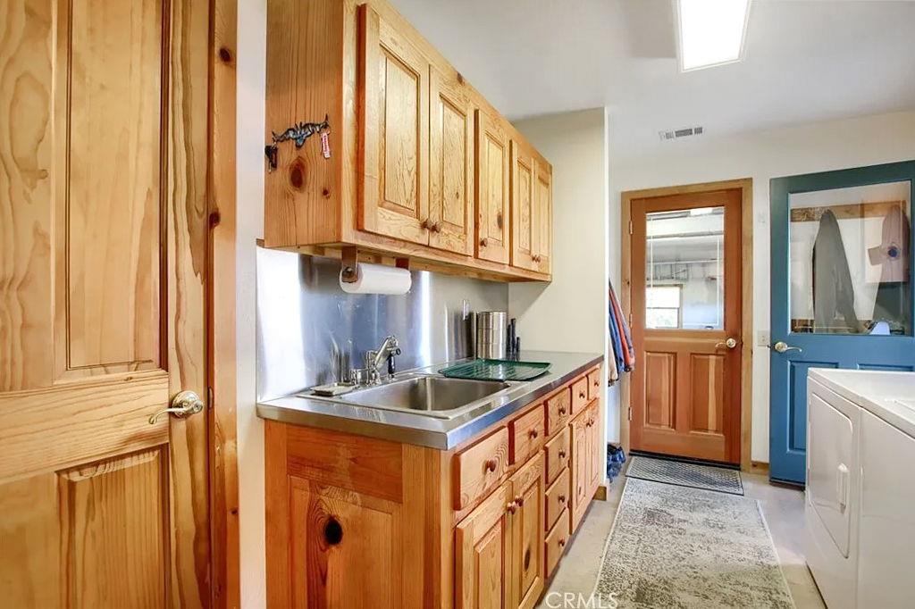 5851 Mt Bullion Ridge Road Mariposa, CA 95338 - Photo 42 of 83 a kitchen with stainless steel appliances granite countertop a sink and a refrigerator