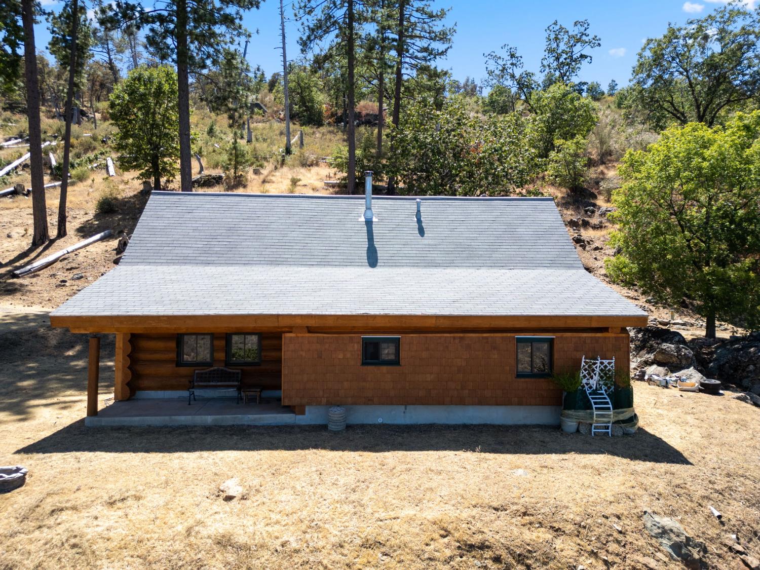 5851 Mt Bullion Ridge Road Mariposa, CA 95338 - Photo 57 of 83 a front view of a house with a yard covered with snow