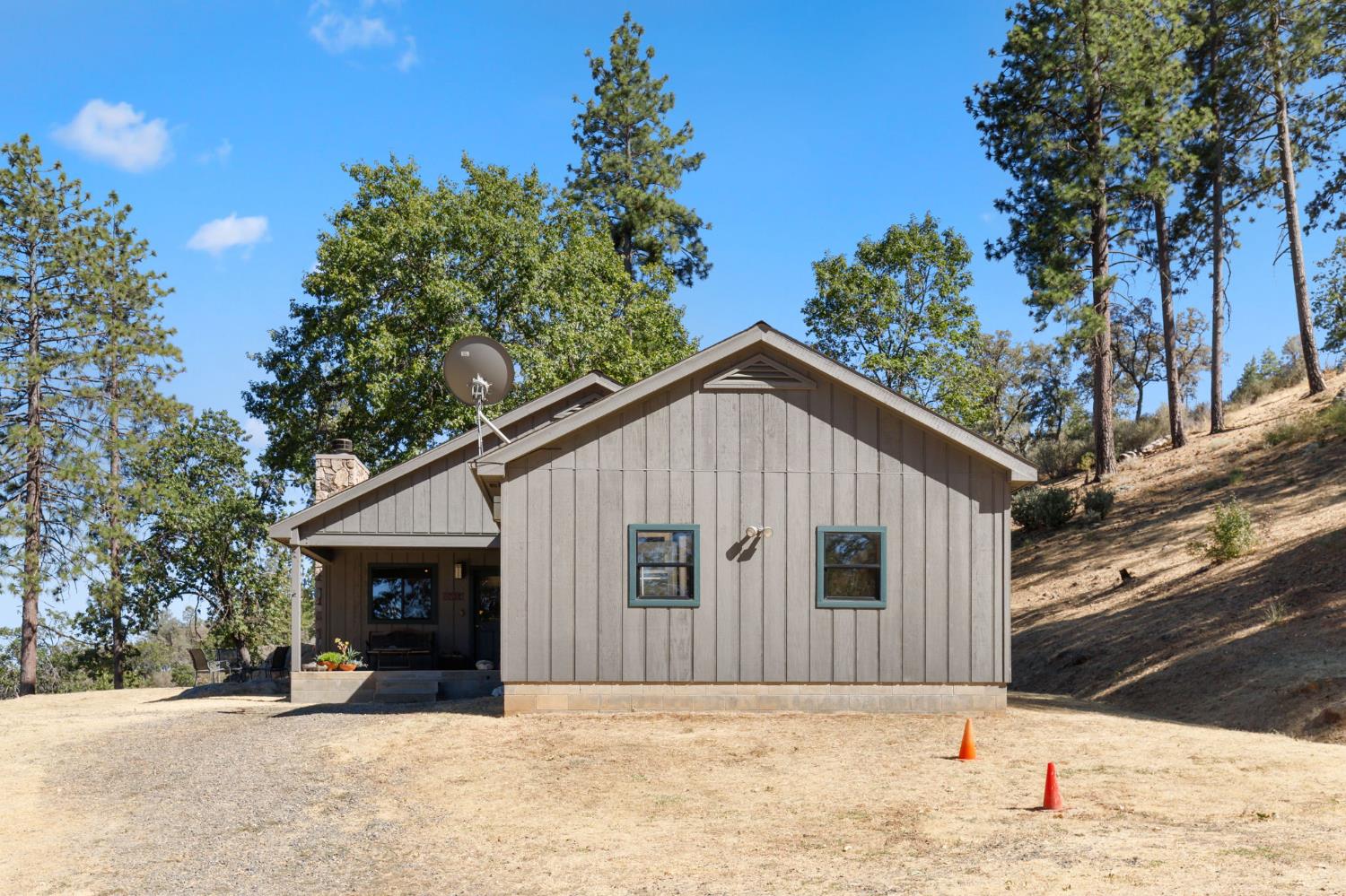 5851 Mt Bullion Ridge Road Mariposa, CA 95338 - Photo 71 of 83 a front view of a house with a yard covered with snow in front of house