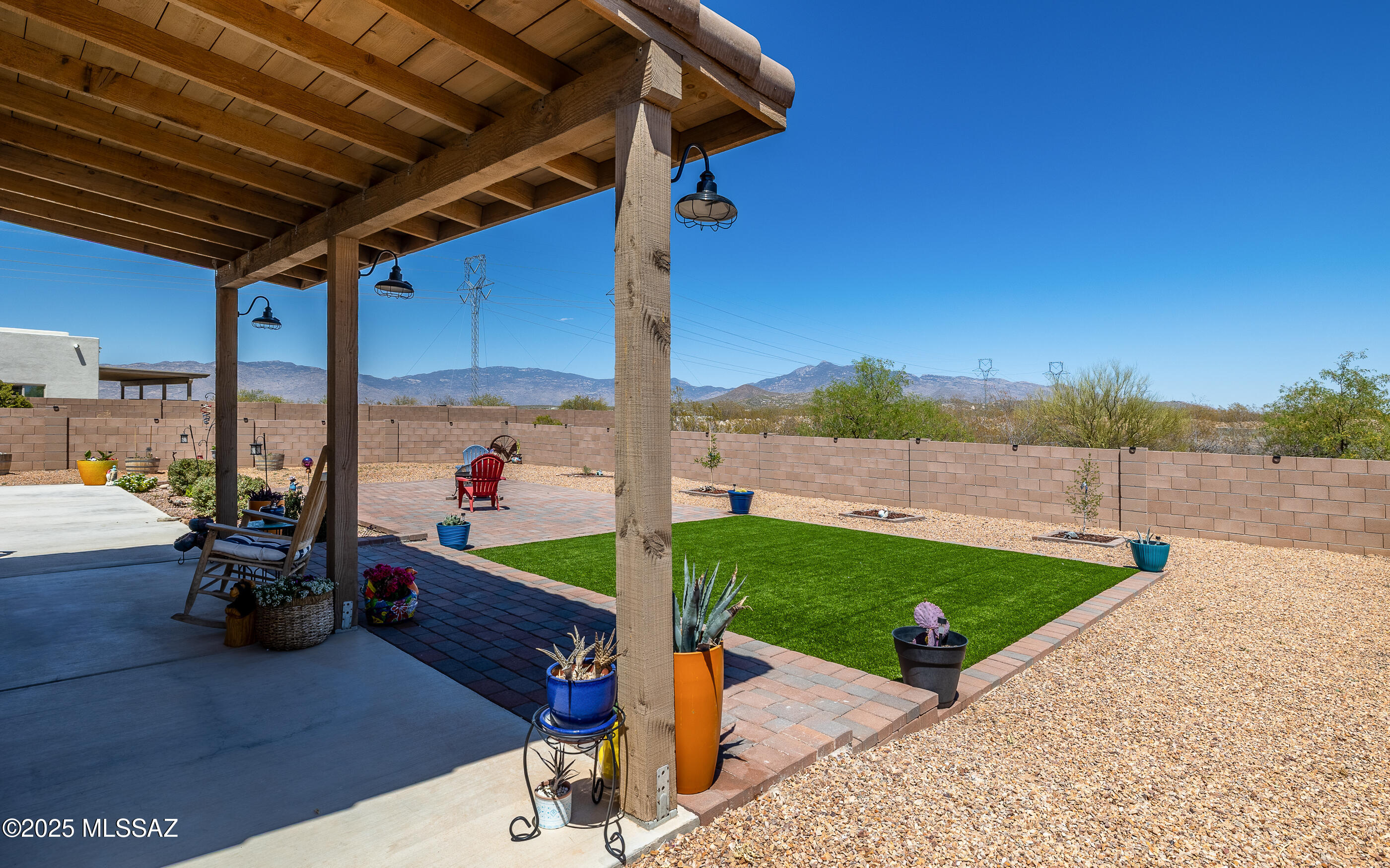 12123 Creosote Valley Road Vail, AZ 85641 - Photo 26 of 46 a view of a patio with chairs and a table