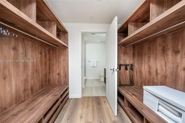 a bedroom with a bed and a television