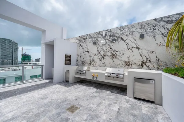 a view of swimming pool with a lounge chair