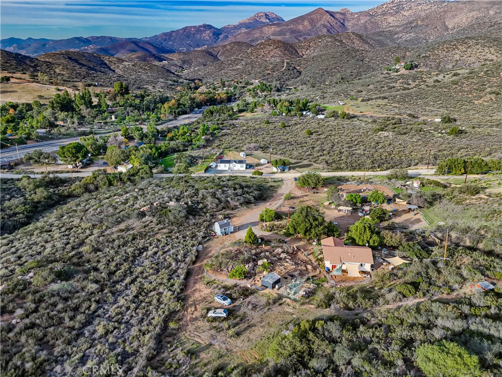 1473 Arnoldo Road Dulzura, CA 91917 - Photo 13 of 19 a view of a city with mountains in the background