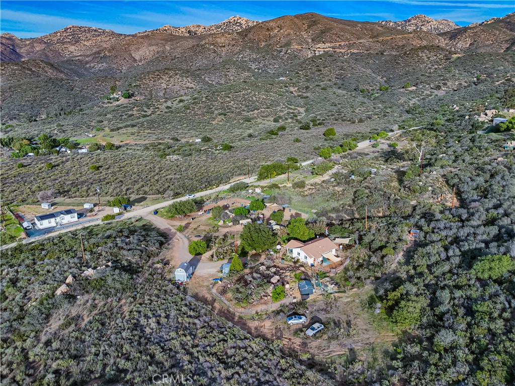 1473 Arnoldo Road Dulzura, CA 91917 - Photo 19 of 19 a view of a field with mountains in the background