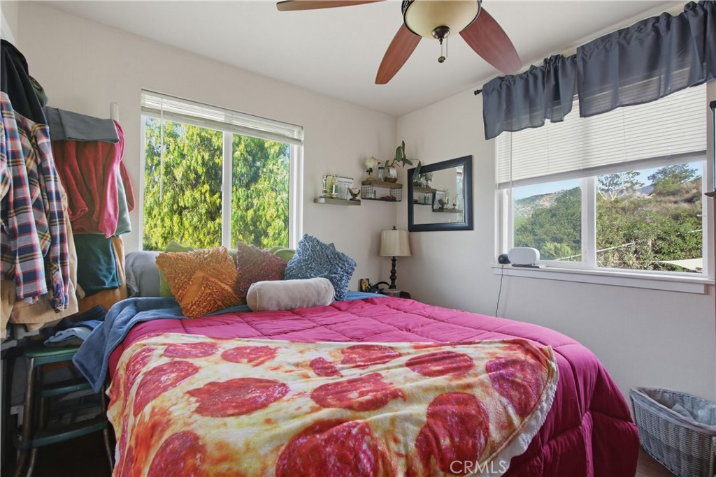 1473 Arnoldo Road Dulzura, CA 91917 - Photo 7 of 19 a bedroom with a large bed and a window