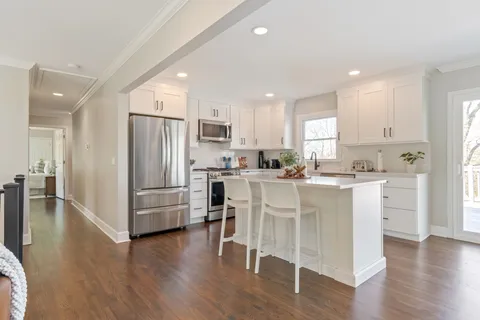 a spacious bedroom with a bed and a window