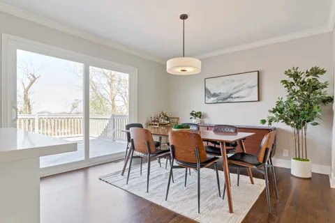 a bathroom with a toilet a sink and a mirror