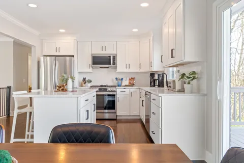 a bedroom with a bed and a book shelf