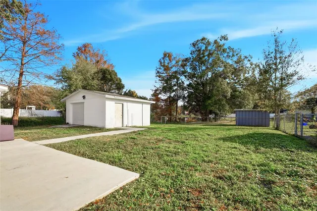 a backyard of a house with lots of green space