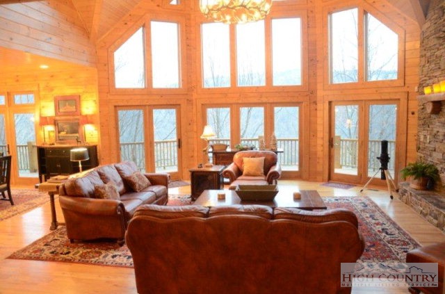 495 Mulberry Mountain Road Boone, NC 28607 - Photo 13 of 36 a living room with furniture or couch and a large window