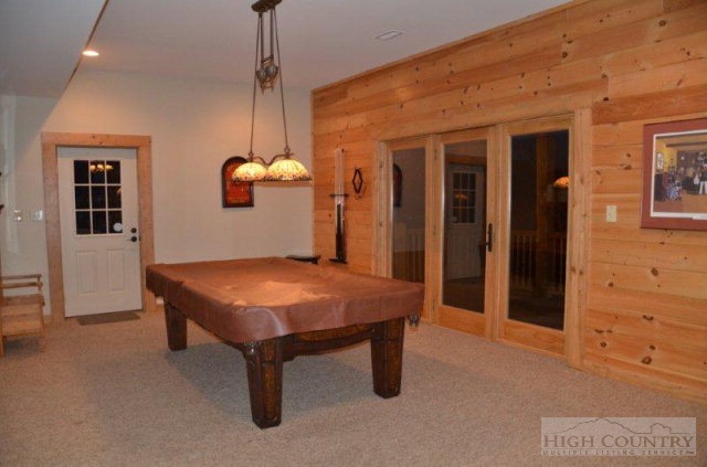 495 Mulberry Mountain Road Boone, NC 28607 - Photo 16 of 36 a room with pool table and windows