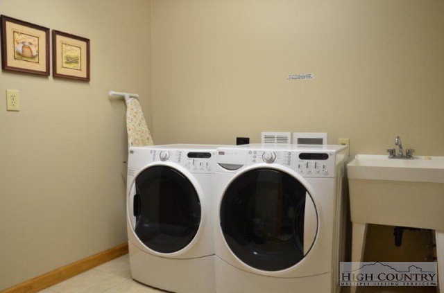 495 Mulberry Mountain Road Boone, NC 28607 - Photo 17 of 36 a utility room with dryer and washer