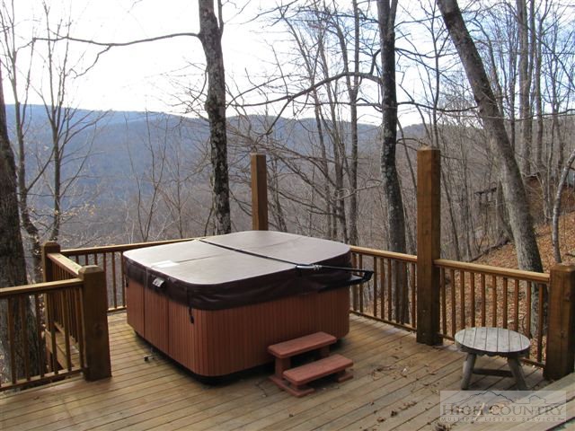 495 Mulberry Mountain Road Boone, NC 28607 - Photo 18 of 36 a view of a balcony with wooden floor and fence