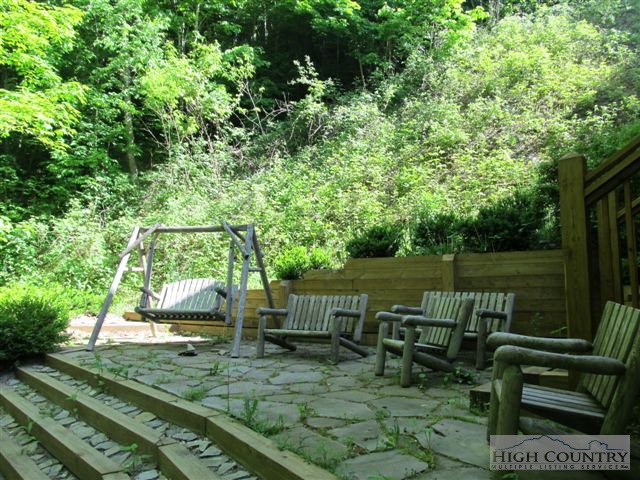 495 Mulberry Mountain Road Boone, NC 28607 - Photo 26 of 36 a view of a bench in the garden