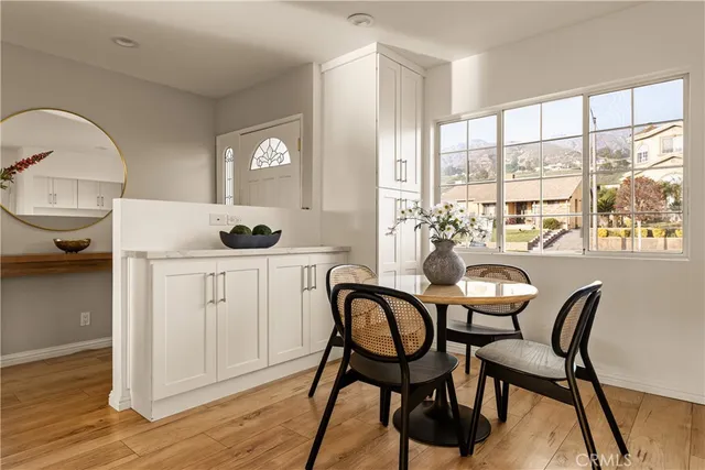 a dining room with furniture and window