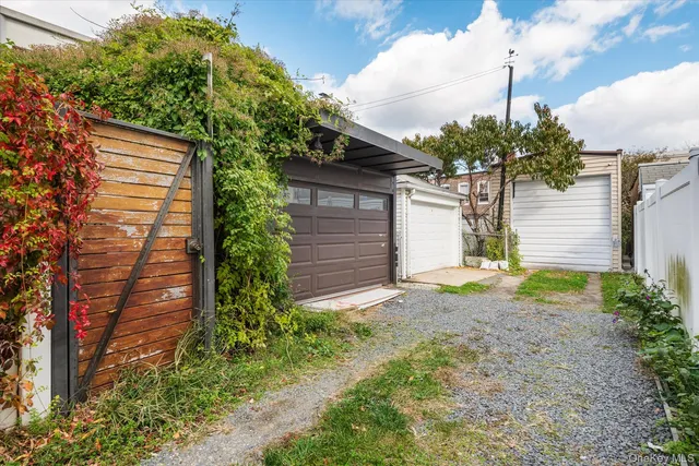 a house that has a tree in front of it
