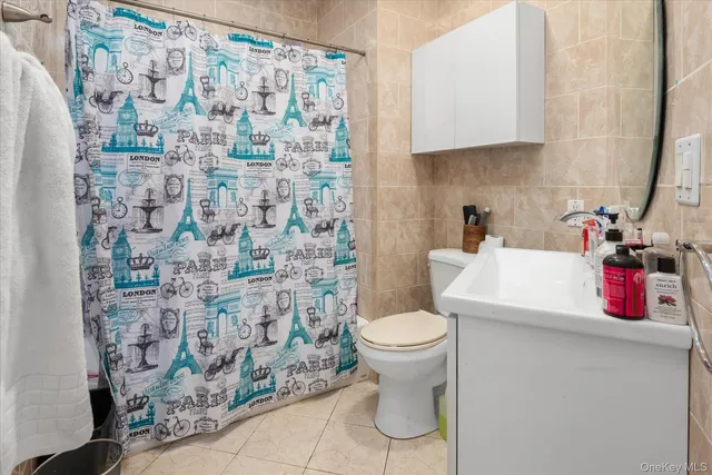 a bathroom with a toilet and a sink