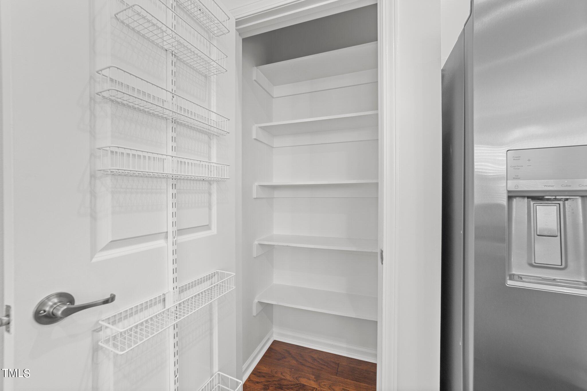 5627 Wade Park Boulevard Raleigh, NC 27607 - Photo 11 of 44 a view of walk in closet with empty racks