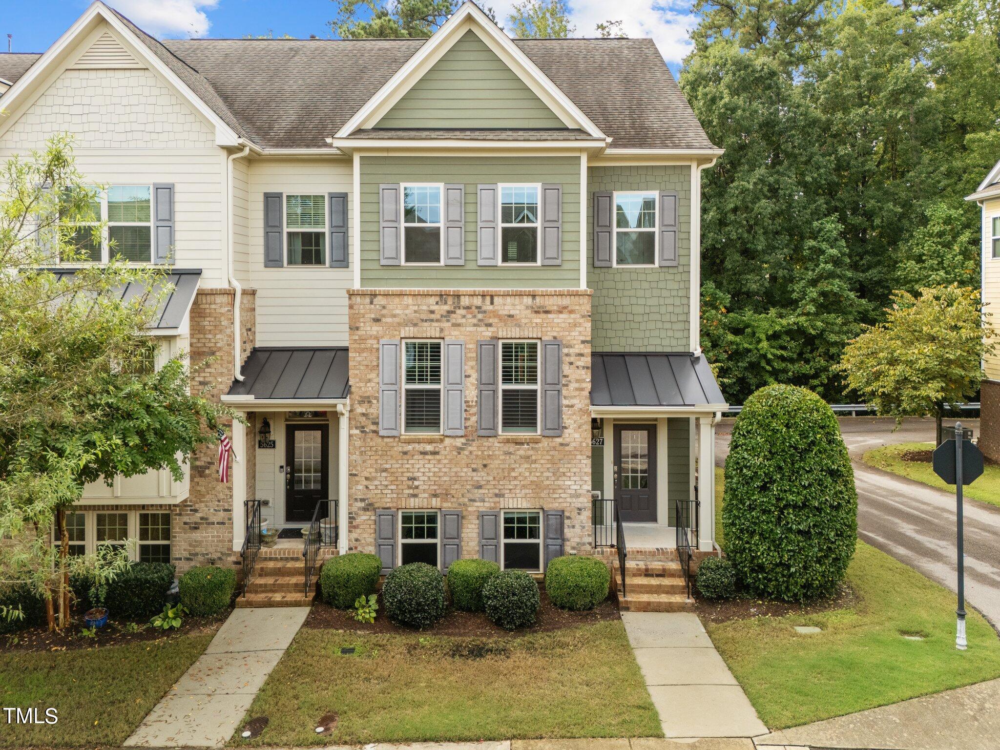 5627 Wade Park Boulevard Raleigh, NC 27607 - Photo 2 of 44 a front view of a house with garden