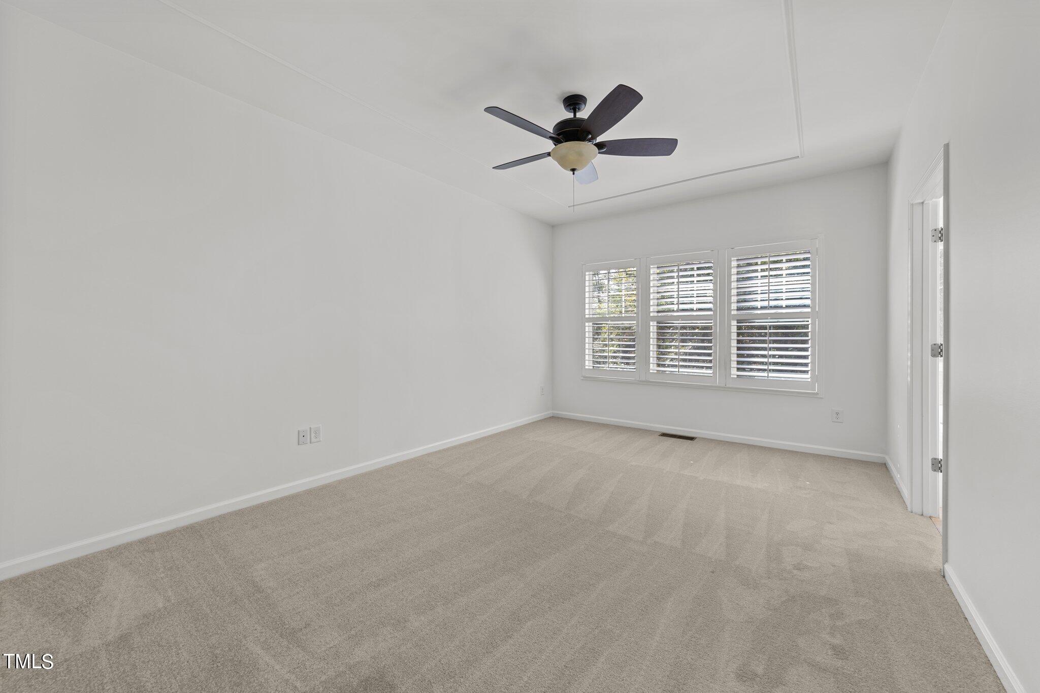 5627 Wade Park Boulevard Raleigh, NC 27607 - Photo 26 of 44 a view of an empty room with a window