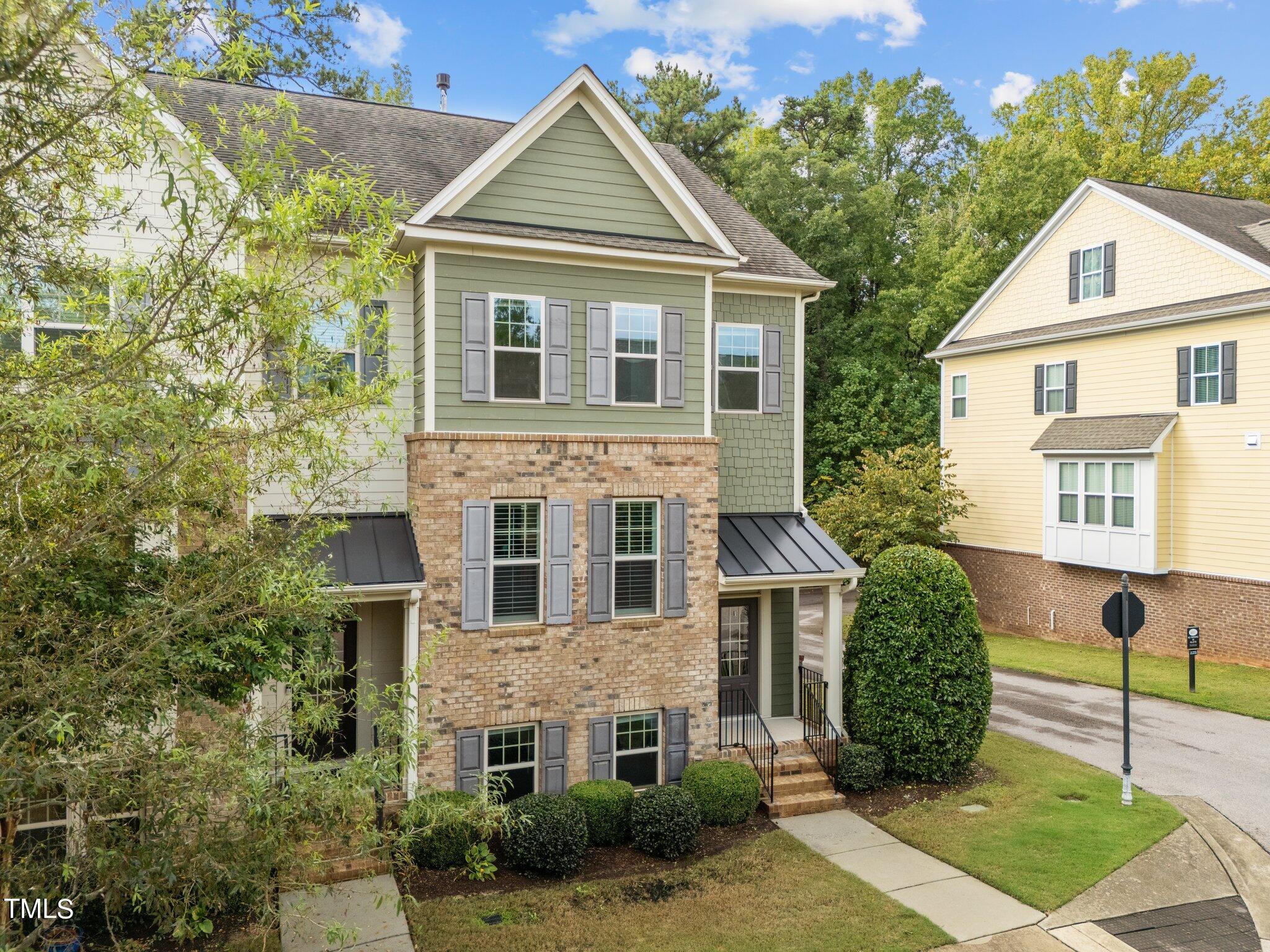 5627 Wade Park Boulevard Raleigh, NC 27607 - Photo 3 of 44 a front view of a house with garden