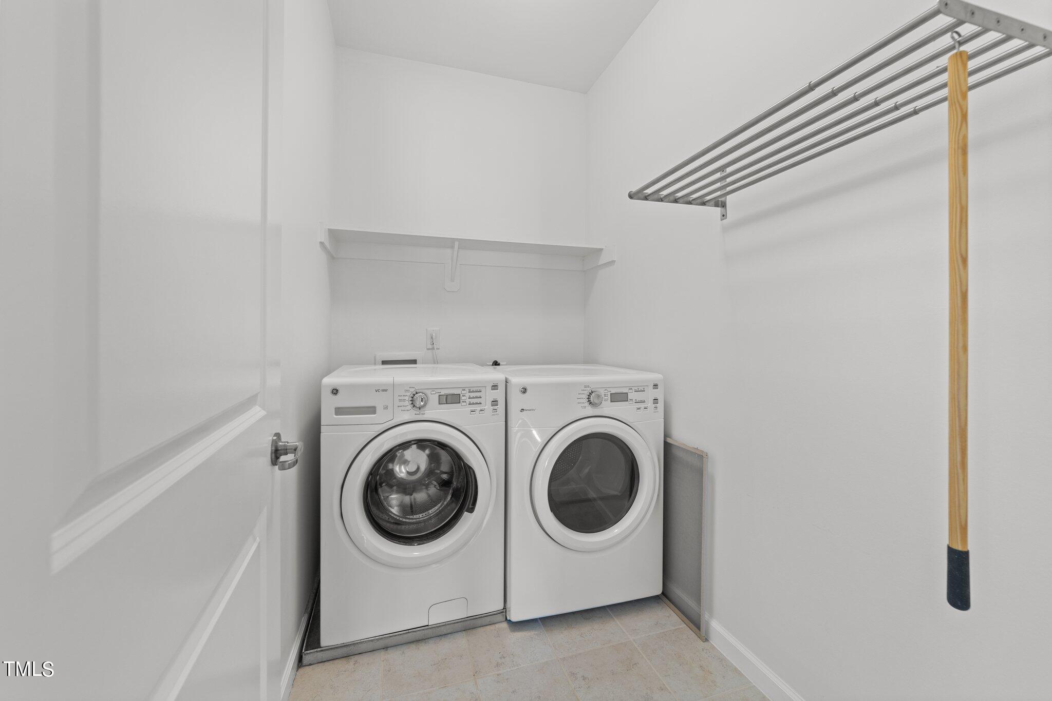 5627 Wade Park Boulevard Raleigh, NC 27607 - Photo 30 of 44 a utility room with dryer and washer