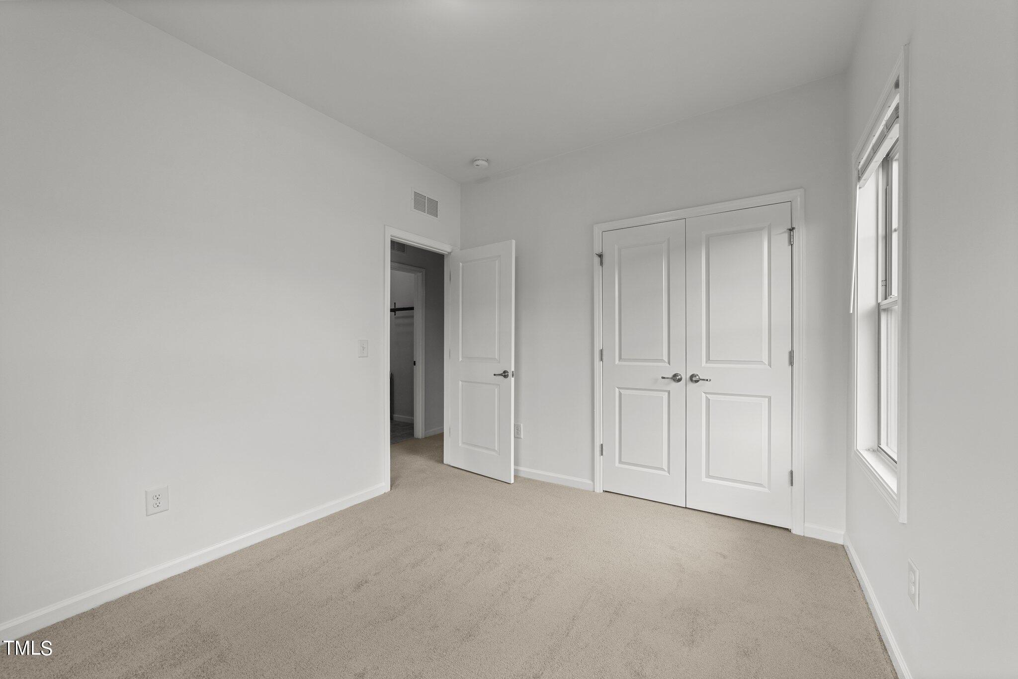 5627 Wade Park Boulevard Raleigh, NC 27607 - Photo 32 of 44 a view of an empty room and closet area