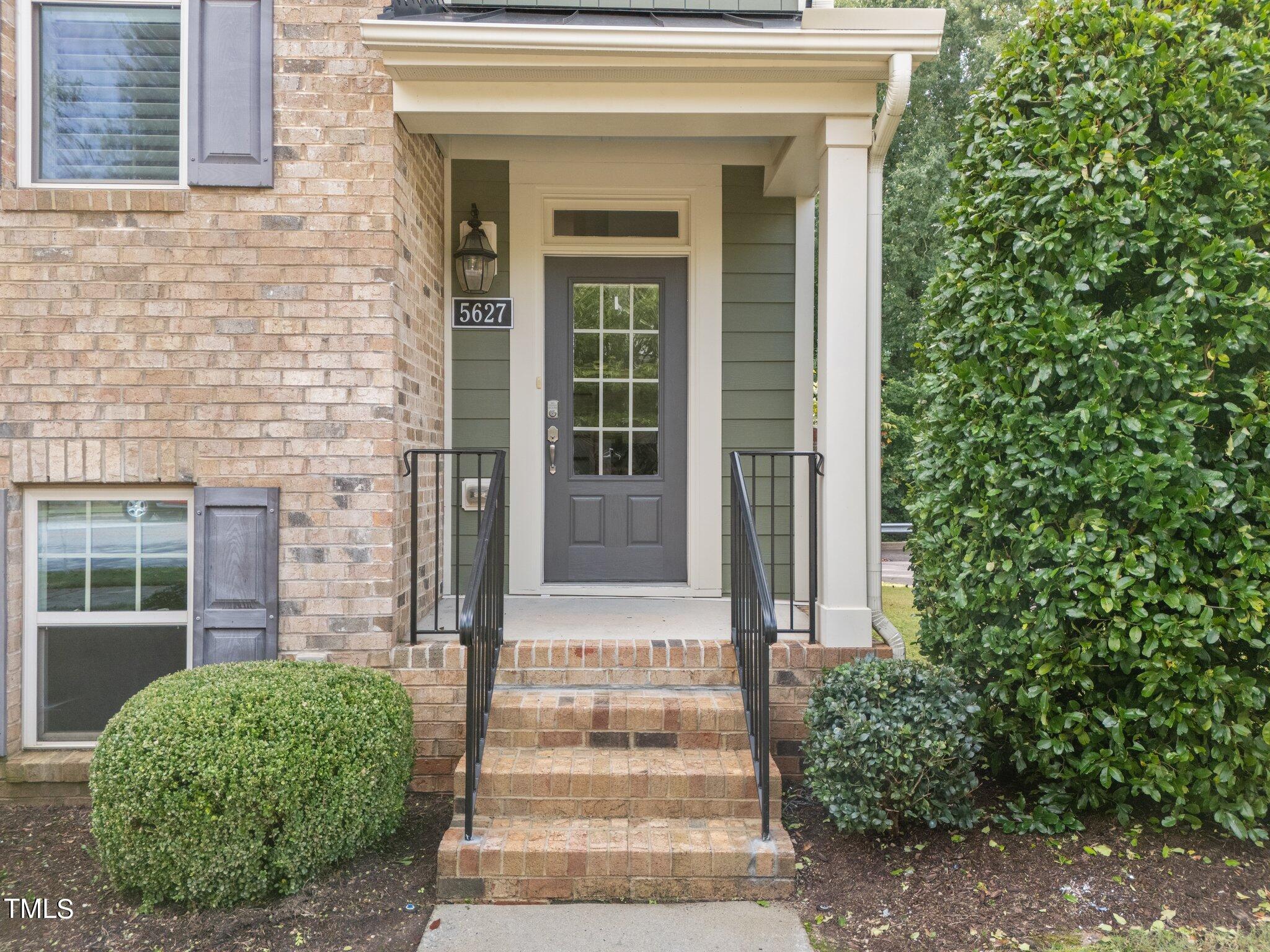 5627 Wade Park Boulevard Raleigh, NC 27607 - Photo 4 of 44 a front view of a house with garden