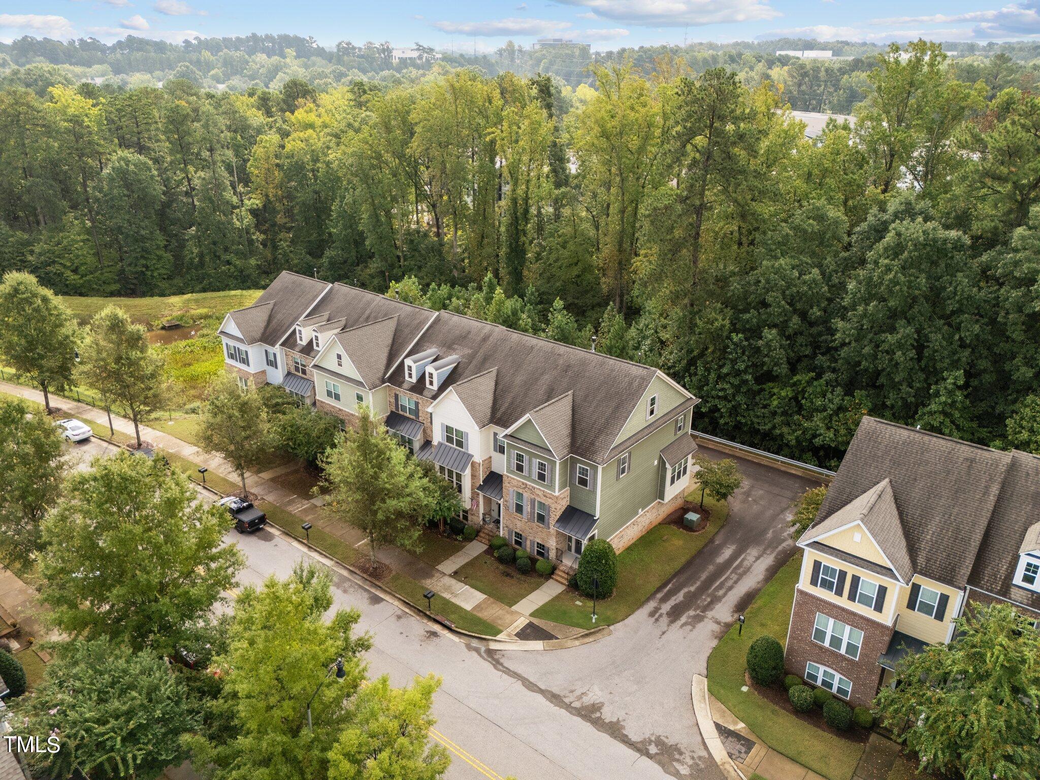 5627 Wade Park Boulevard Raleigh, NC 27607 - Photo 41 of 44 a aerial view of a house with a yard