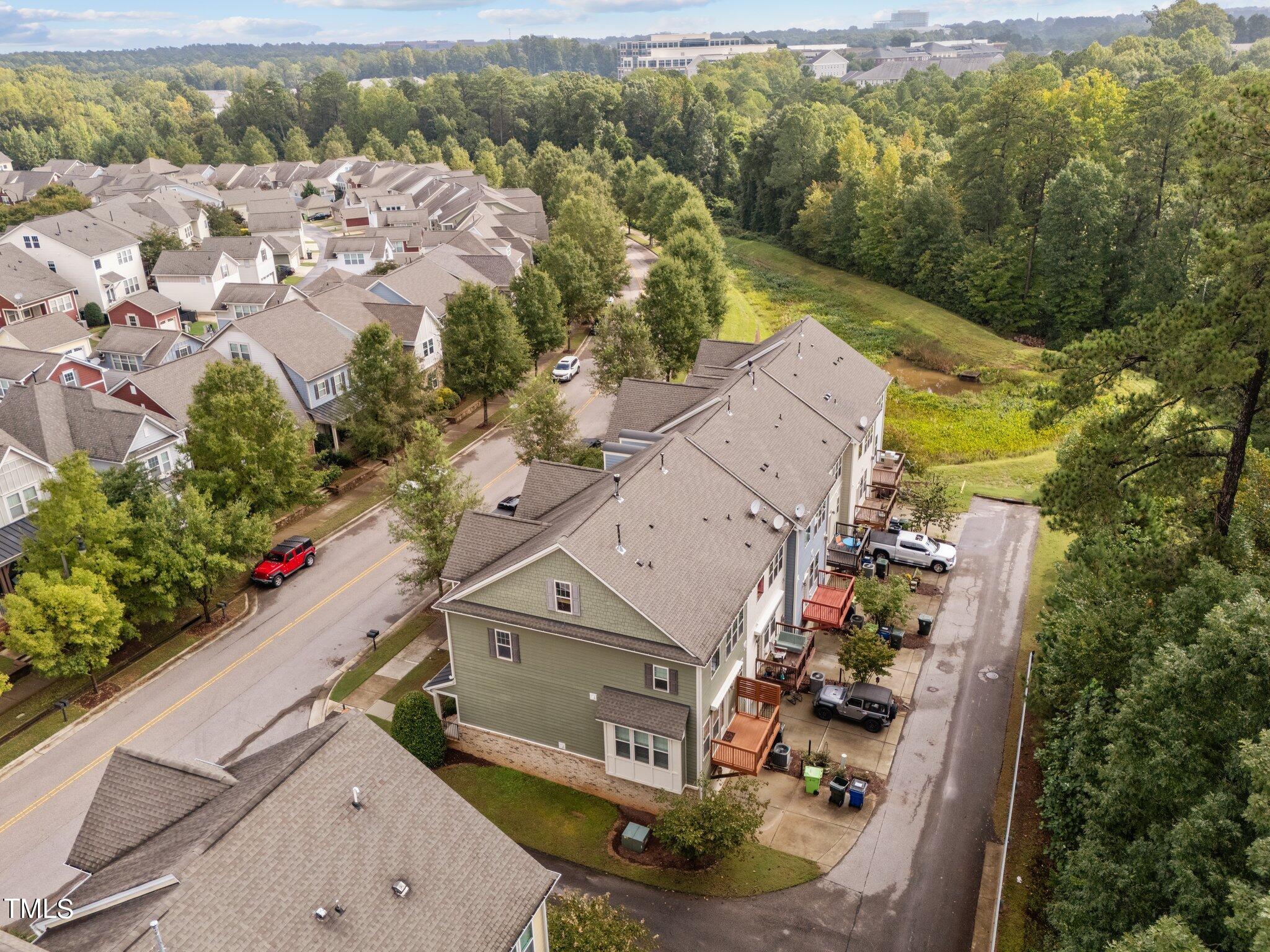 5627 Wade Park Boulevard Raleigh, NC 27607 - Photo 42 of 44 an aerial view of a house with a yard