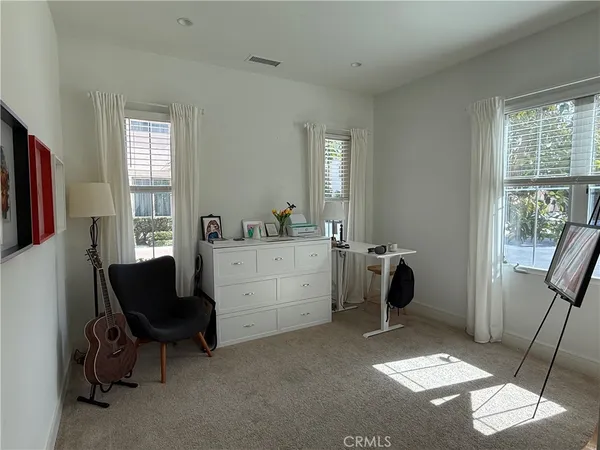 a view of livingroom with furniture and windows