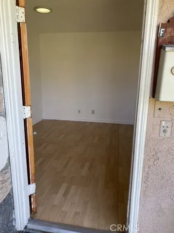 a view of balcony with wooden floor