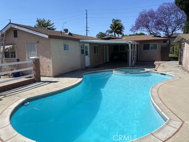 a view of a house with a swimming pool