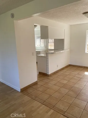 a view of kitchen with microwave and cabinets