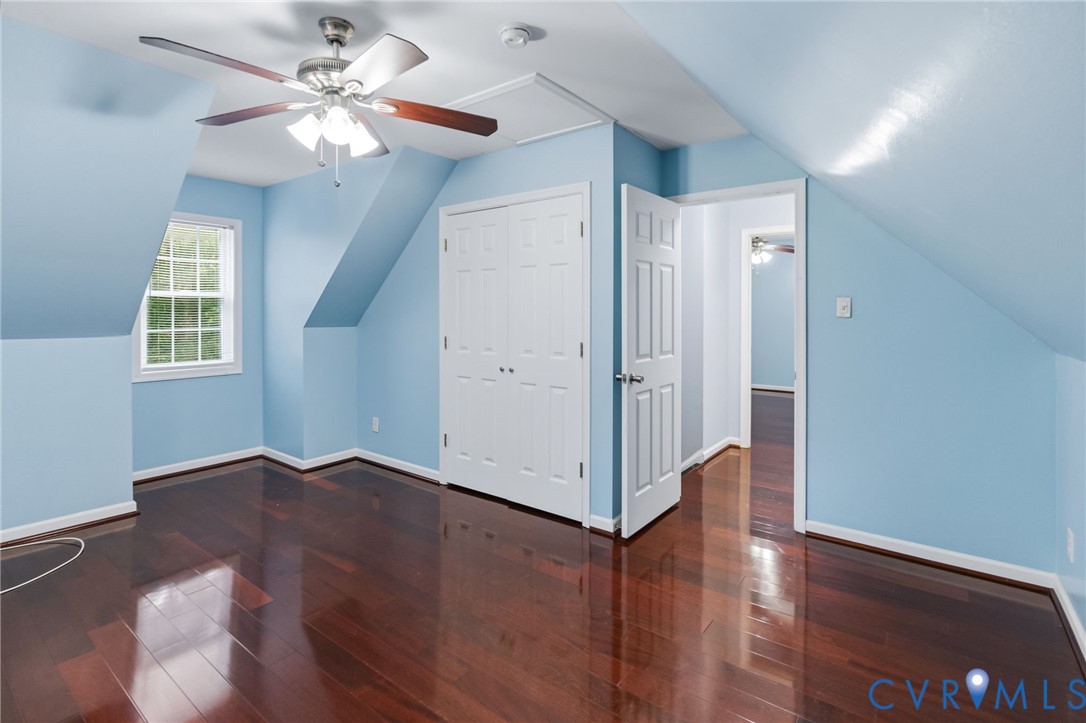 2869 Newville Road Disputanta, VA 23842 - Photo 18 of 26 Rich wood-finish flooring, a ceiling fan with ligh
