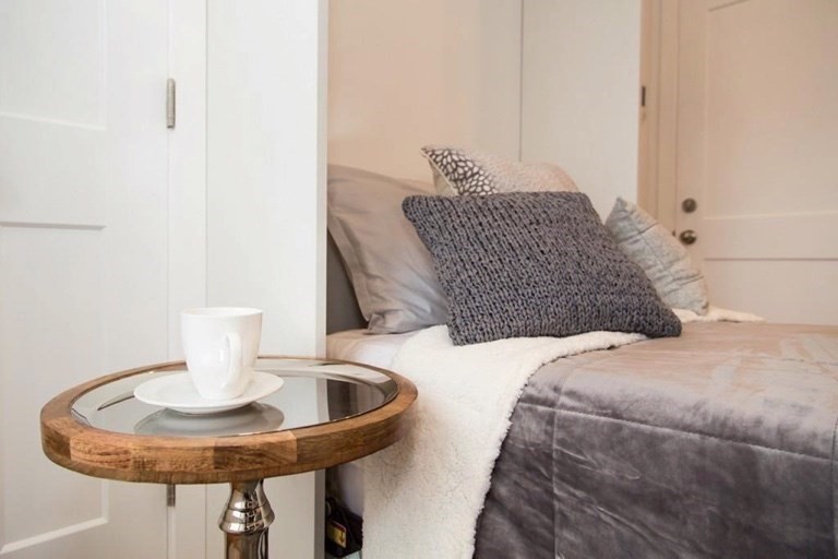 21 5th Street, Unit 1 Chelsea, MA 02150 - Photo 1 of 10 a bedroom with a bed and chandelier