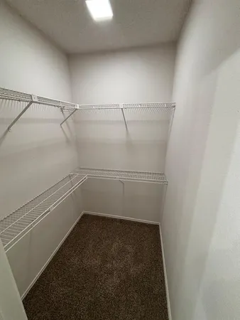 a view of a room with racks on the wall