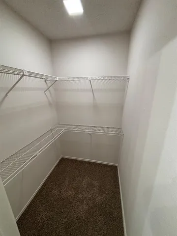 a view of a room with racks on the wall