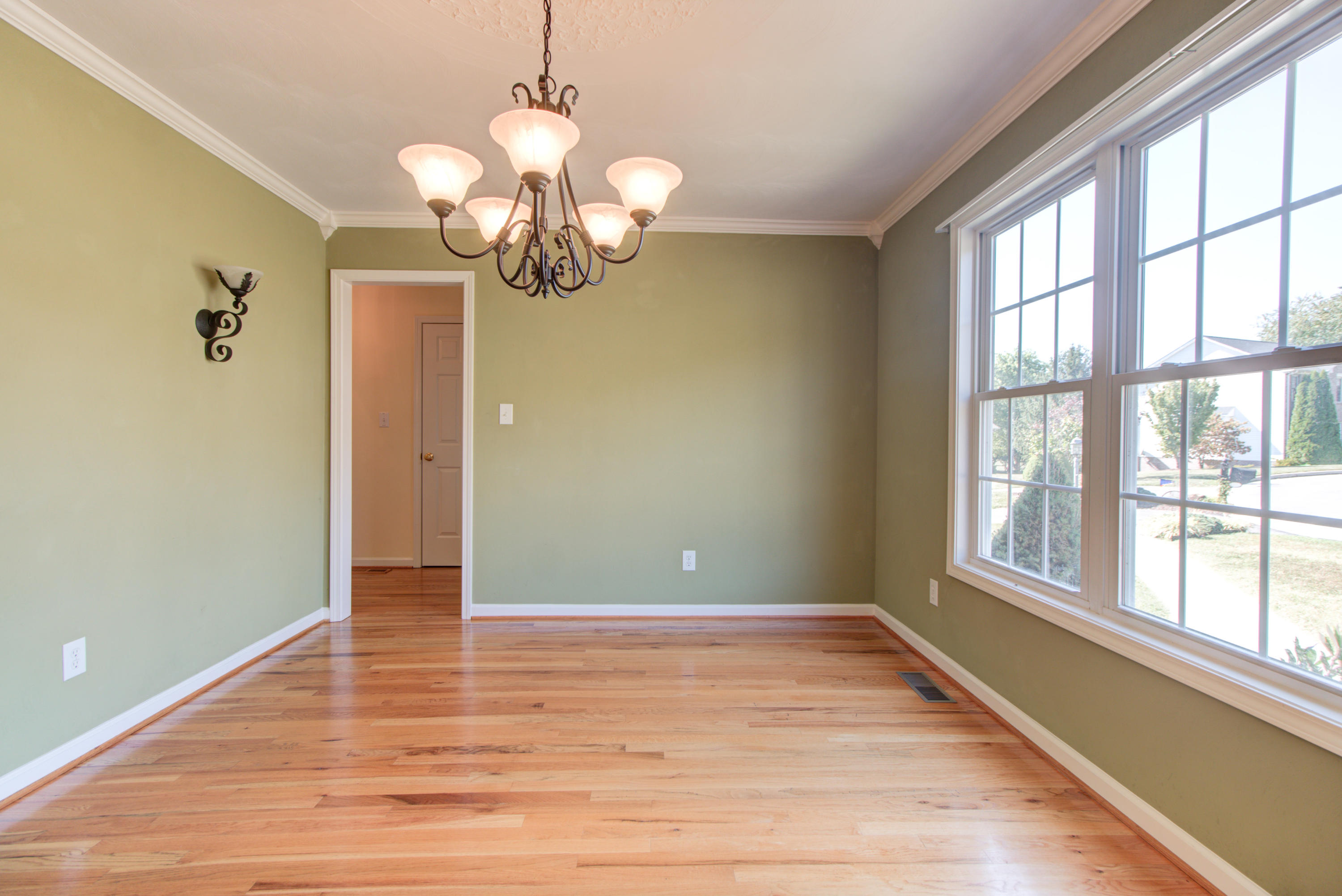 1781 Meadows Road Vinton, VA 24179 - Photo 7 of 26 a view of an empty room with wooden floor and a window