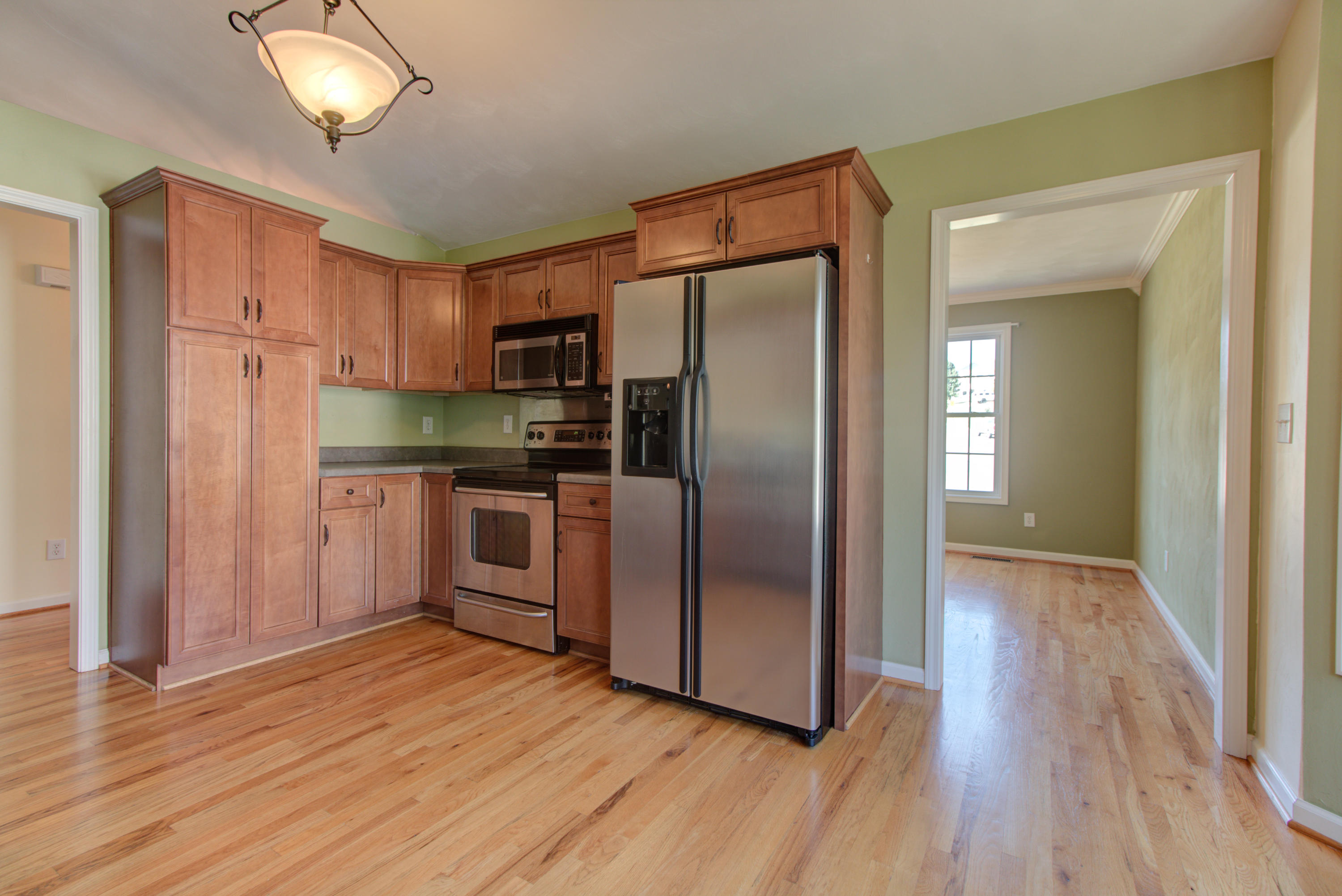 1781 Meadows Road Vinton, VA 24179 - Photo 9 of 26 a kitchen with stainless steel appliances a refrigerator and a stove top oven