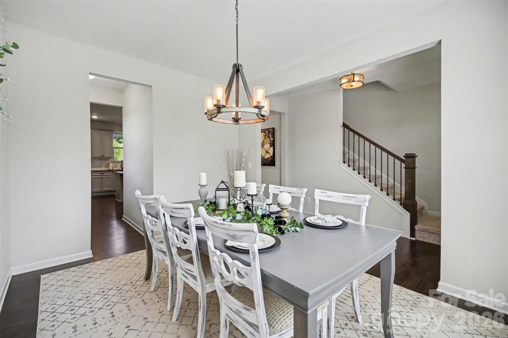514 Tack Lane Midland, NC 28107 - Photo 5 of 48 a dining room with furniture a chandelier and wooden floor