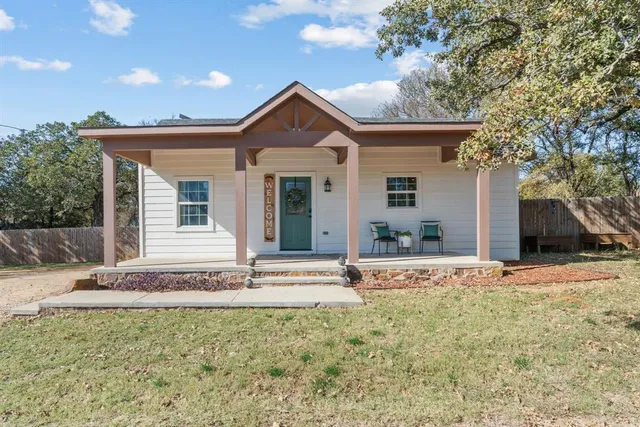 front view of a house with a yard
