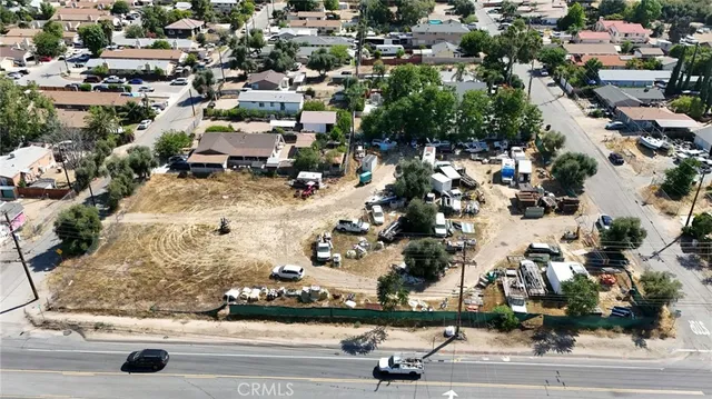 an aerial view of residential houses with yard