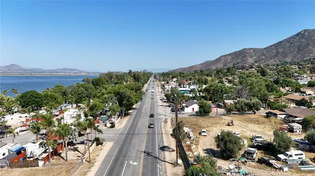 an aerial view of residential house and sandy dunes