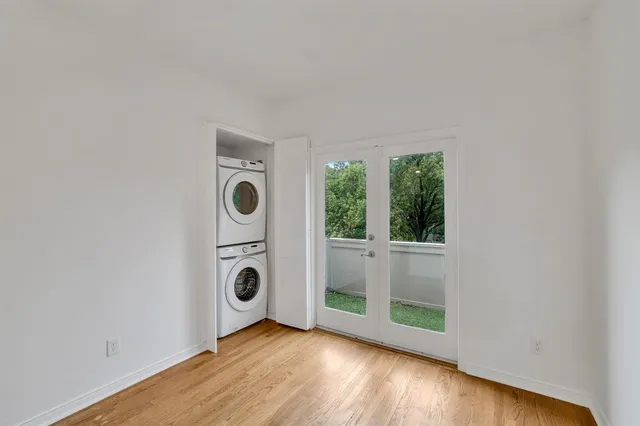 a view of an entryway with wooden floor