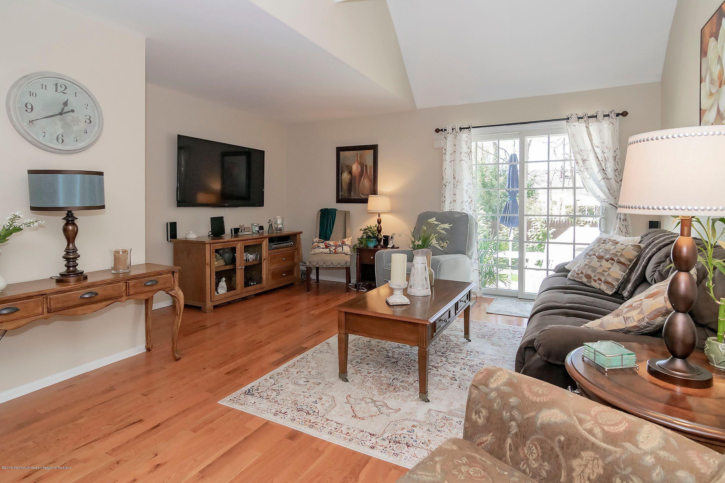 40 Wyckham Road Spring Lake Heights, NJ 07762 - Photo 8 of 29 a living room with furniture fireplace and a flat screen tv