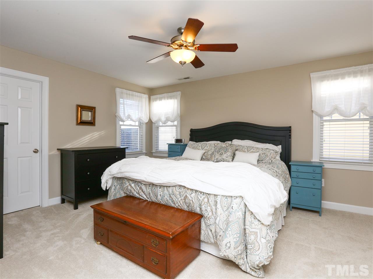 2220 Karns Place Raleigh, NC 27614 - Photo 11 of 25 a bedroom with a bed window and a chandelier