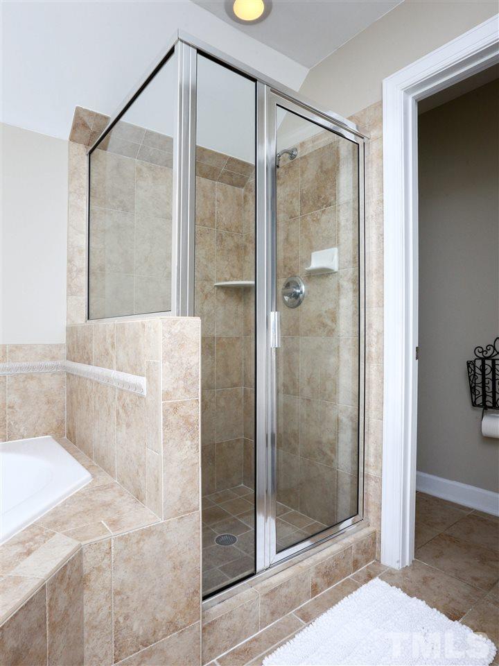 2220 Karns Place Raleigh, NC 27614 - Photo 13 of 25 a bathroom with a glass shower door