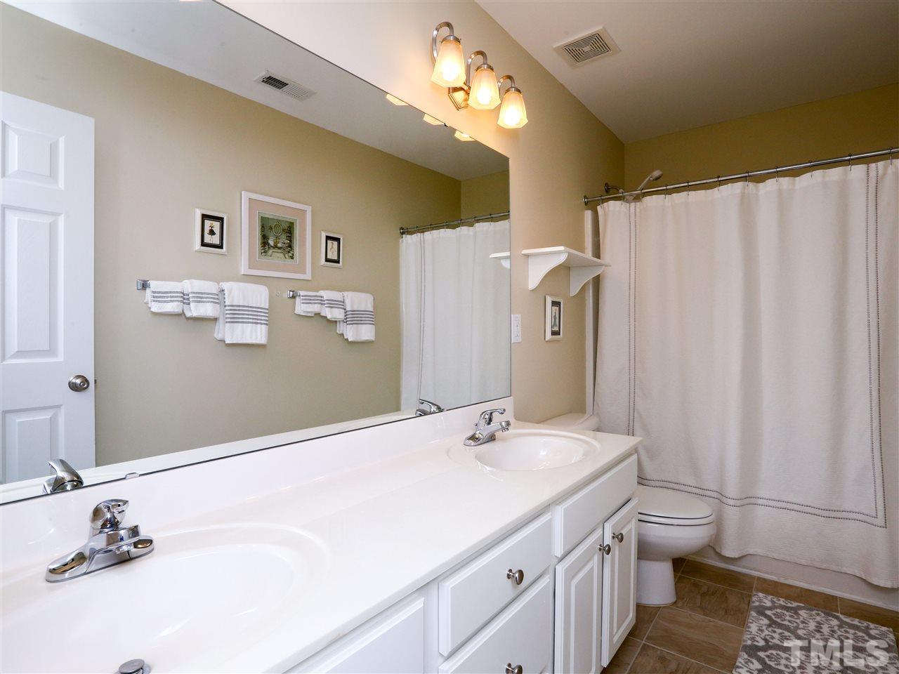 2220 Karns Place Raleigh, NC 27614 - Photo 15 of 25 a bathroom with a double vanity sink mirror and toilet
