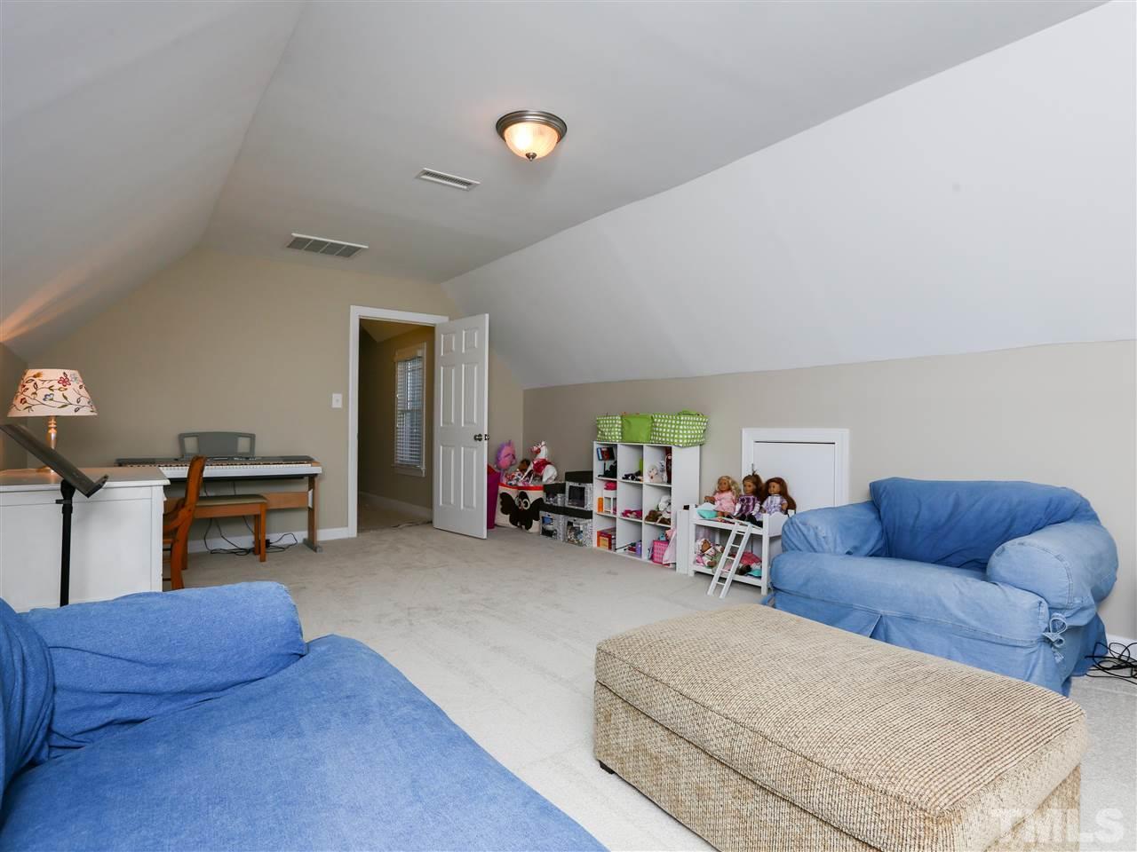 2220 Karns Place Raleigh, NC 27614 - Photo 18 of 25 a living room with furniture and a wooden floor
